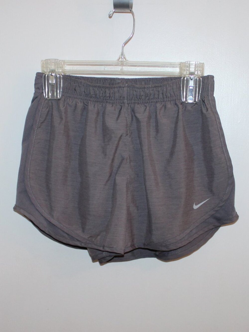 Grey Nike Dri-FIT Tempo running shorts featuring an elastic waistband, Size Med